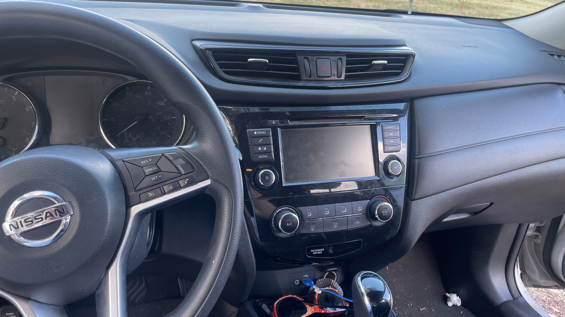 Dusty Nissan interior dashboard before detailing